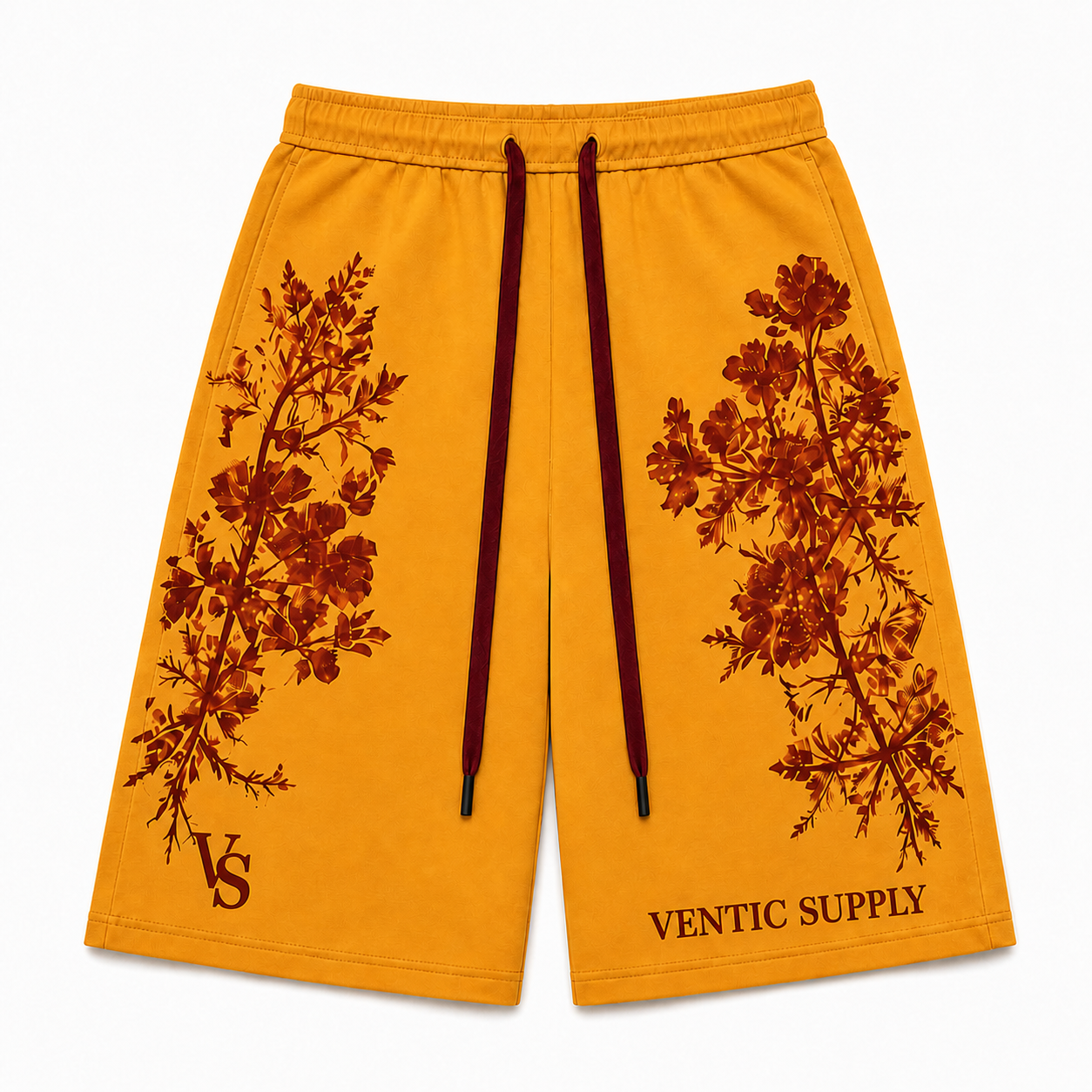 Bright amber botanical long wide shorts shown alone from the front